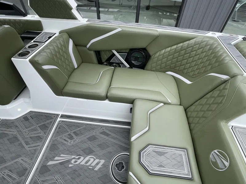 Slide: The Image of Interior of 2024 Tigé 24RZX with green leather seating. - 20