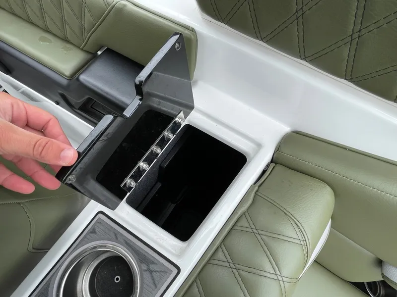 Slide: The Image of Interior of 2024 Tigé 24RZX with storage compartment and cup holder. - 21