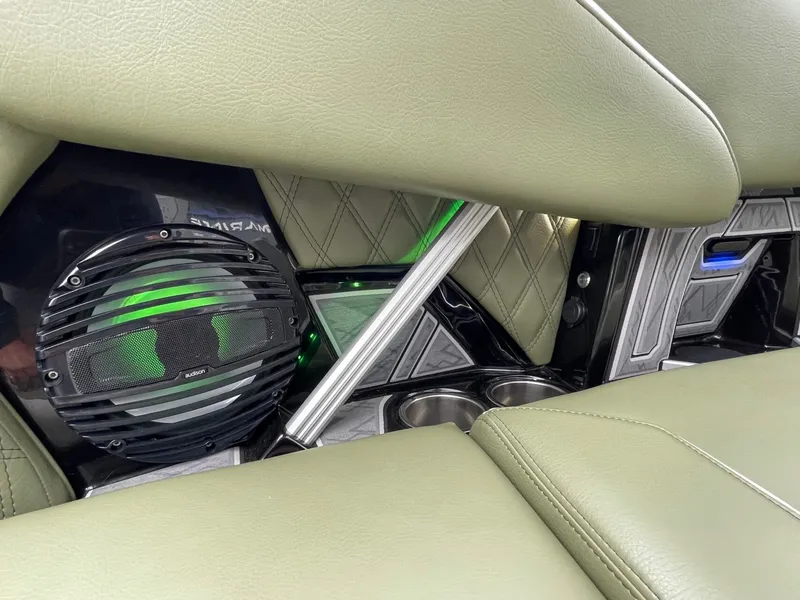 Slide: The Image of Interior of 2024 Tigé 24RZX with speaker and green lighting. - 25