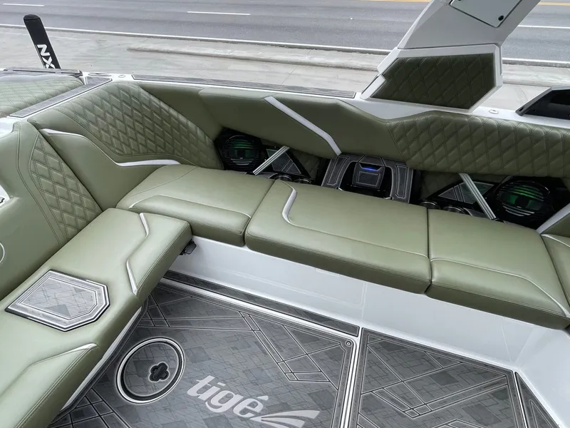 Slide: The Image of Interior of 2024 Tigé 24RZX with green upholstery. - 26