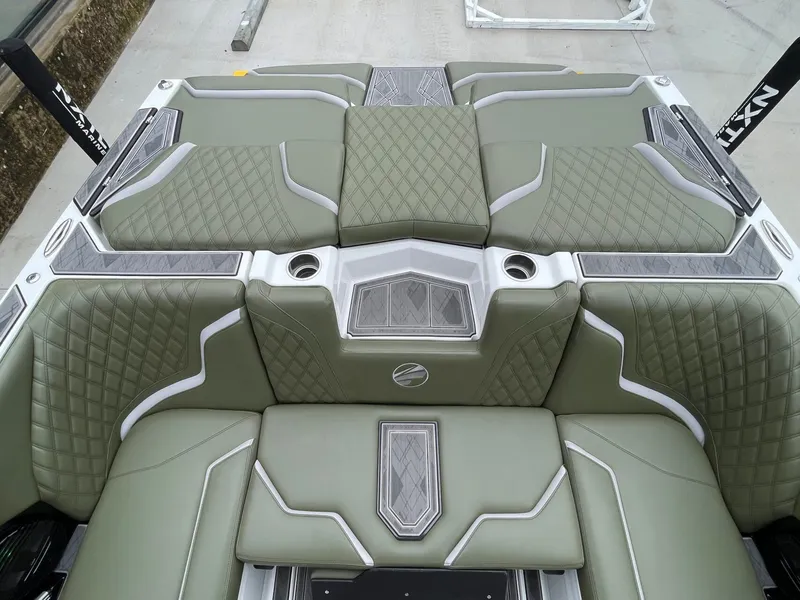 Slide: The Image of 2024 Tigé 24RZX interior with green upholstery and diamond stitching. - 27