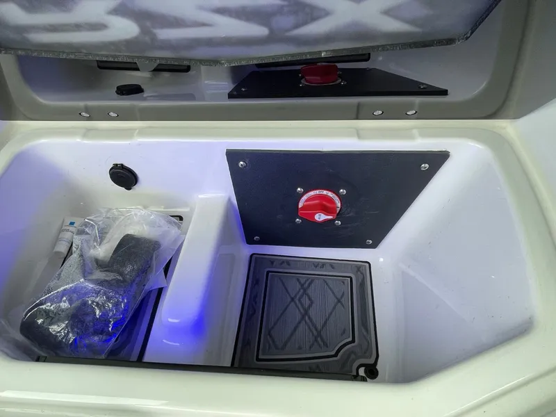 Slide: The Image of Interior of 2024 Tigé 24RZX with storage compartment and switch. - 33