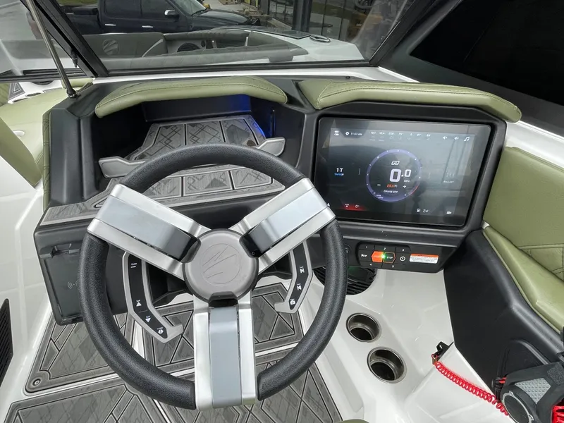 Slide: The Image of Interior view of 2024 Tigé 24RZX boat with modern dashboard. - 36