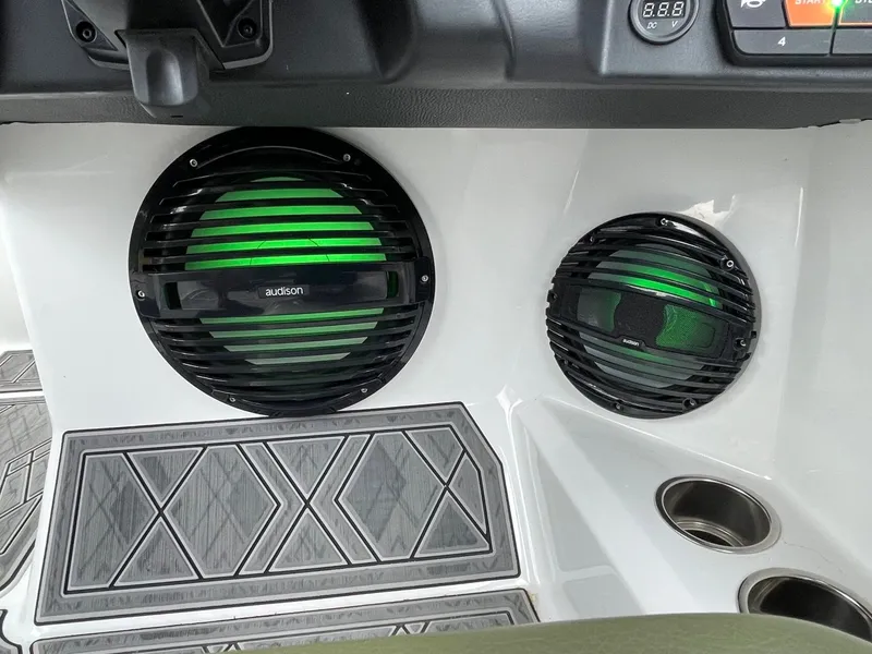 Slide: The Image of 2024 Tigé 24RZX boat featuring Audison speakers with green lighting. - 39