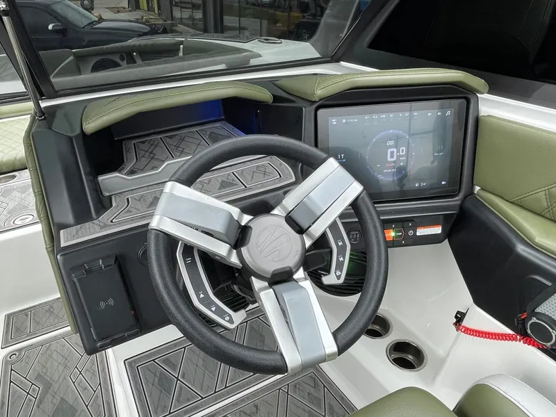 Slide: The Image of 2024 Tigé 24RZX interior with modern steering wheel and touchscreen display. - 40