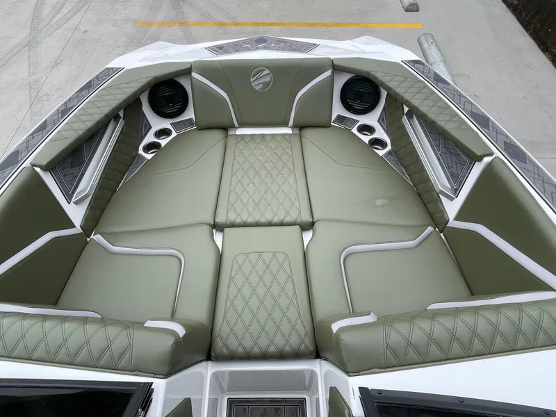 Slide: The Image of Interior of 2024 Tigé 24RZX with green upholstery. - 42