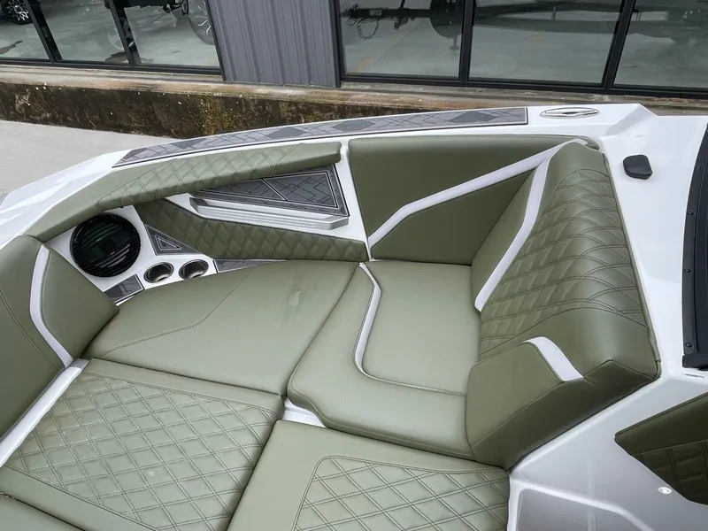 Slide: The Image of Interior of 2024 Tigé 24RZX with green upholstery. - 46