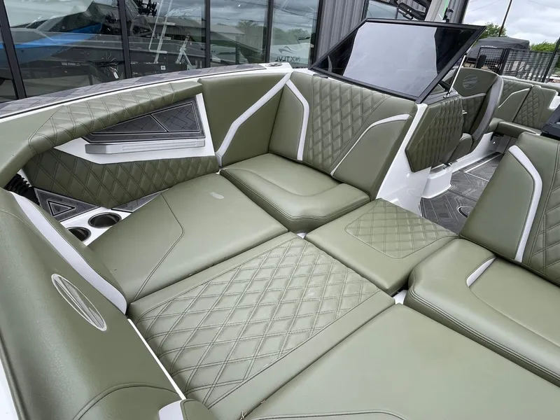 Slide: The Image of 2024 Tigé 24RZX interior with green upholstery. - 48