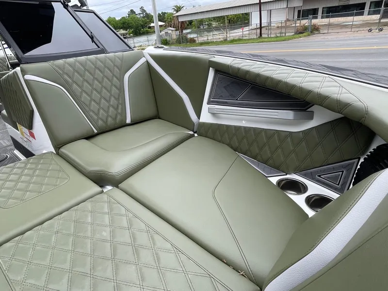Slide: The Image of Interior of 2024 Tigé 24RZX with green upholstery. - 49