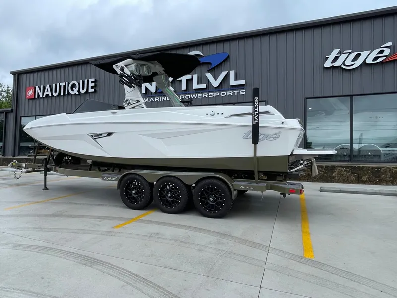 Slide: The Image of 2024 Tigé 24RZX boat parked outside Nautique store. - 5