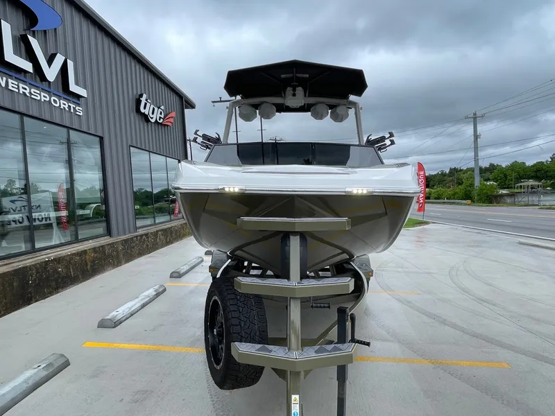 Slide: The Image of 2024 Tigé 24RZX boat in front of a showroom. - 9