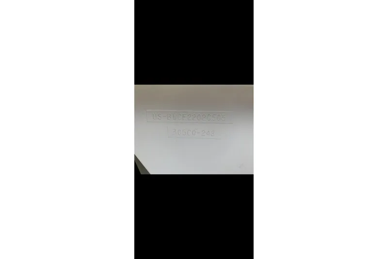 Slide: The Image of Hull identification number on 2005 Boston Whaler 305 Conquest boat. - 26