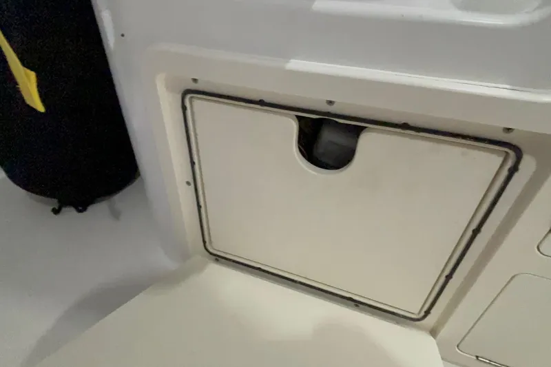 Slide: The Image of Storage compartment on a 2005 Boston Whaler 305 Conquest boat interior. - 27