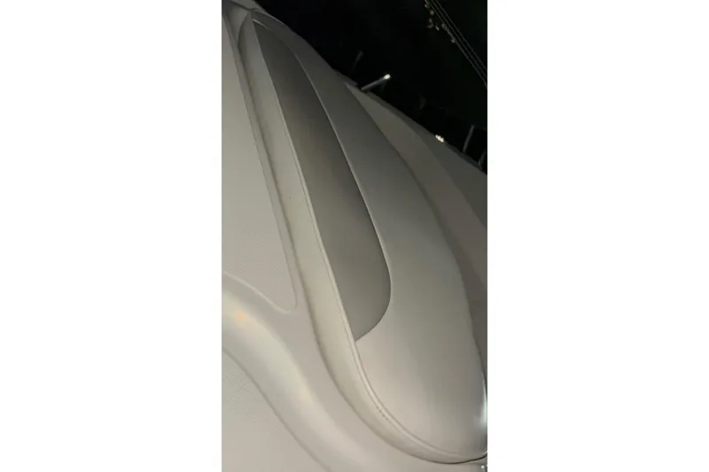 Slide: The Image of Interior detail of 2005 Boston Whaler 305 Conquest boat, featuring sleek upholstery design. - 28