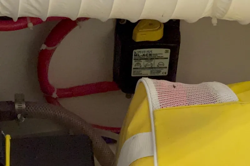 Slide: The Image of 2005 Boston Whaler 305 Conquest interior wiring and battery compartment detail. - 32