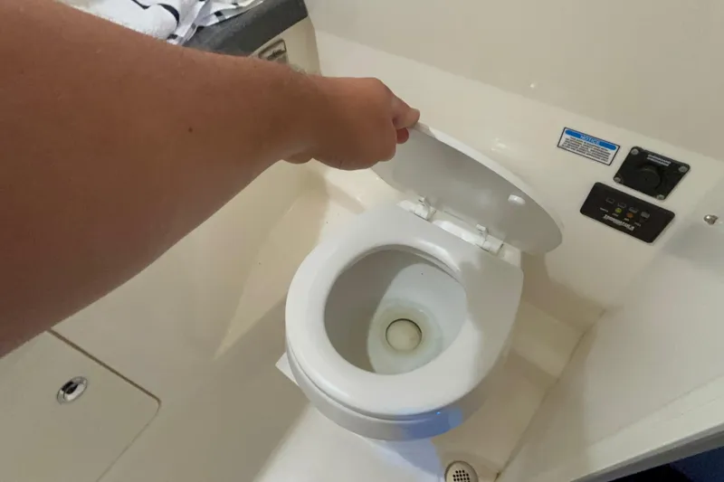 Slide: The Image of Boat bathroom with toilet on 2005 Boston Whaler 305 Conquest. - 39