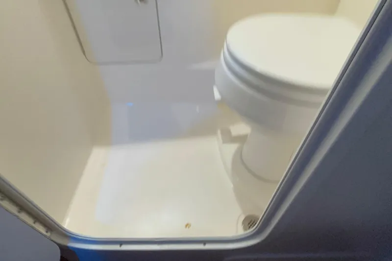 Slide: The Image of 2005 Boston Whaler 305 Conquest boat bathroom interior with toilet. - 40