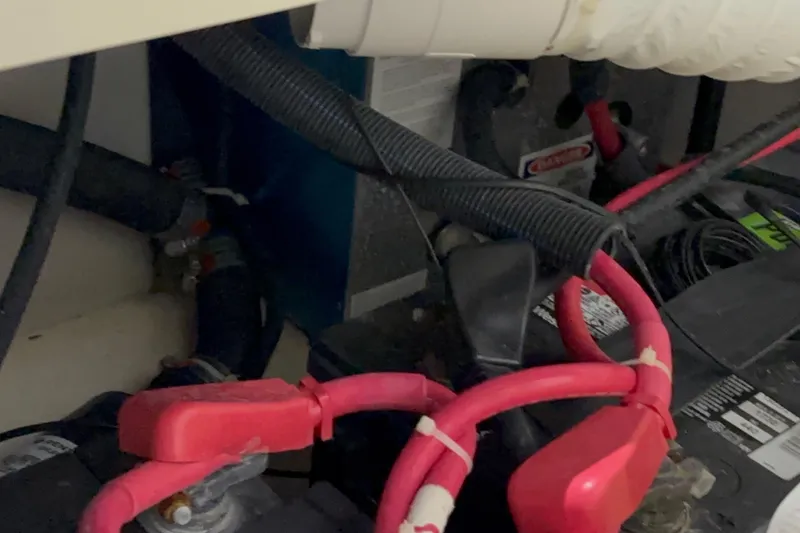 Slide: The Image of Electrical wiring and battery setup in a 2005 Boston Whaler 305 Conquest boat. - 44