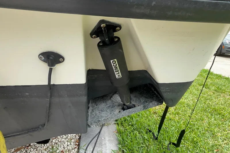 Slide: The Image of 2005 Boston Whaler 305 Conquest boat hull with Lenco trim tab actuator. - 45