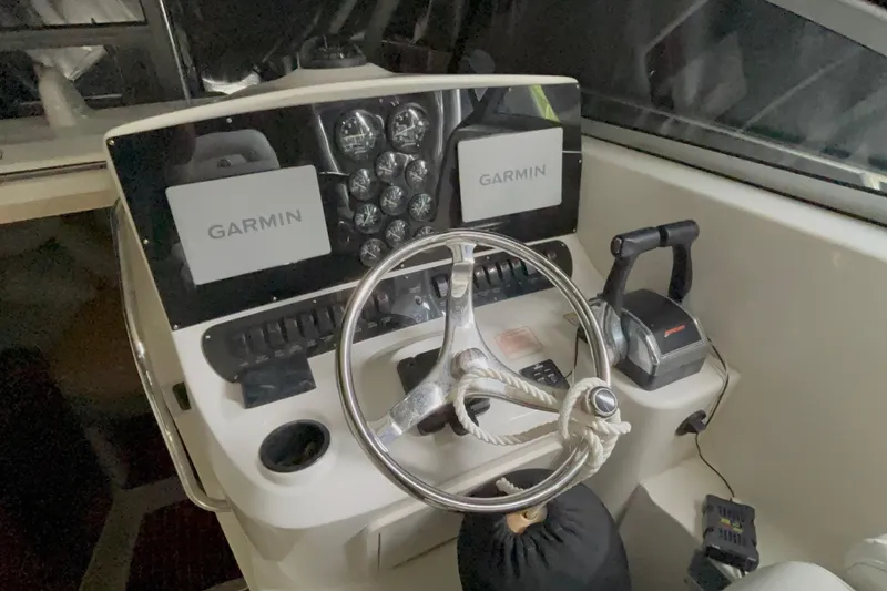 Slide: The Image of Helm of 2005 Boston Whaler 305 Conquest with Garmin navigation system. - 6