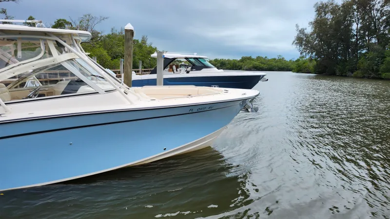 The Image of 2019 Grady-White Freedom 307 boat on calm river. - 0