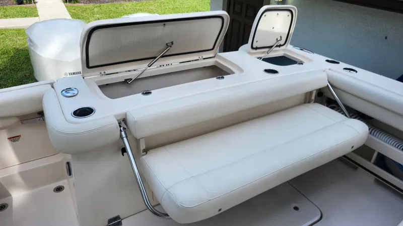 Slide: The Image of 2019 Grady-White Freedom 307 boat with seating and storage compartments. - 11