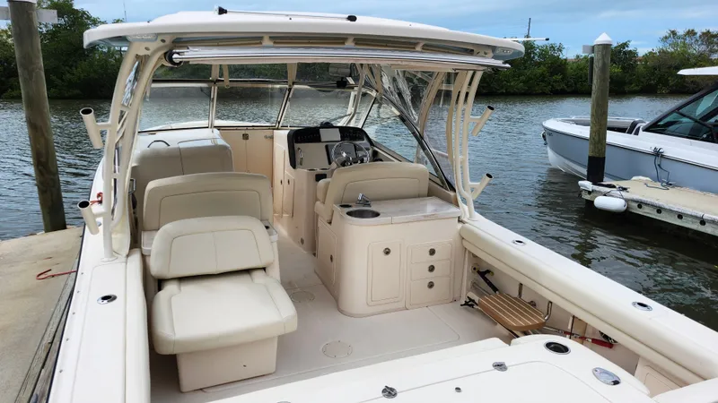 Slide: The Image of Interior view of a 2019 Grady-White Freedom 307 boat at the dock. - 2