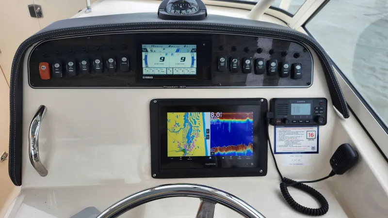 Slide: The Image of Dashboard of a 2019 Grady-White Freedom 307 boat. - 3