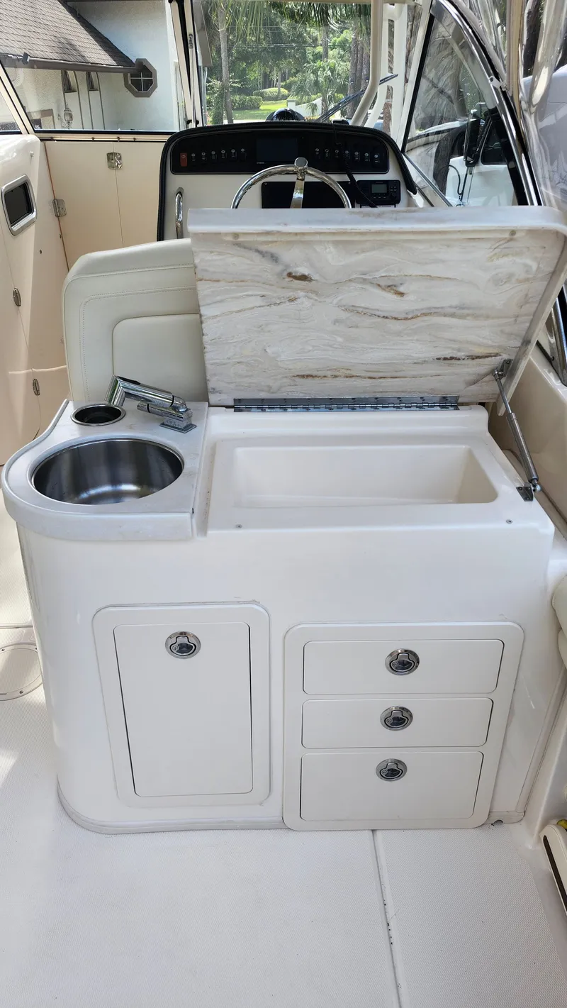 Slide: The Image of Interior of 2019 Grady-White Freedom 307 with sink and storage. - 7