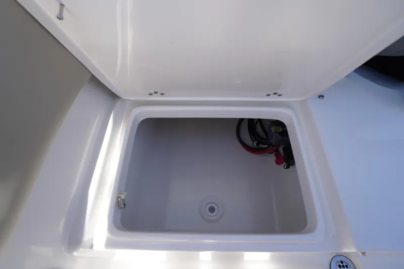 Slide: The Image of Open storage compartment on 2025 Key West 203 FS boat. - 14