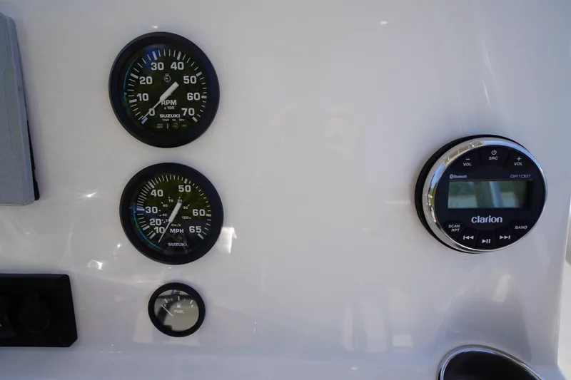 Slide: The Image of Dashboard of 2025 Key West 203 FS boat with gauges and Clarion audio system. - 22