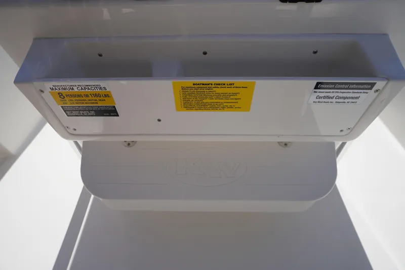 Slide: The Image of 2025 Key West 203 FS boat capacity and emission control labels. - 23