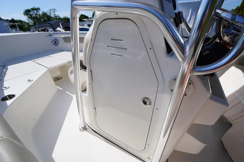 Slide: The Image of 2025 Key West 203 FS boat interior with sleek design and stainless steel railing. - 24