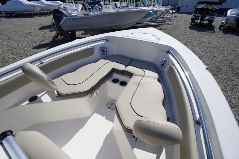Slide: The Image of 2025 Key West 203 FS boat interior with cushioned seating and cup holders. - 32