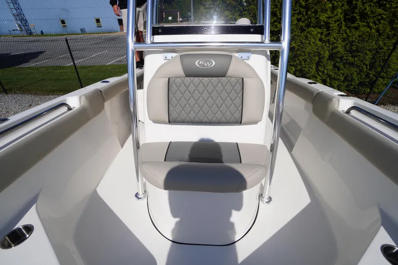 Slide: The Image of 2025 Key West 203 FS boat interior with cushioned seating and stainless steel railing. - 35