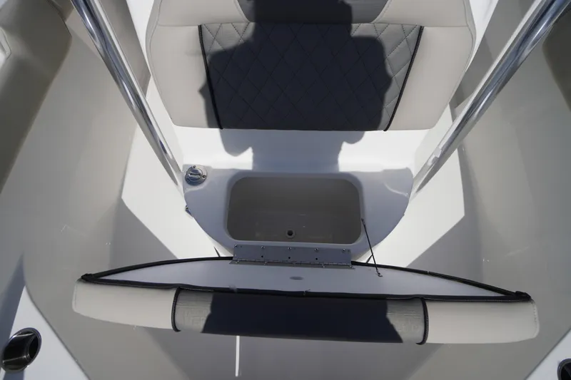 Slide: The Image of 2025 Key West 203 FS boat interior with cushioned seating and storage compartment. - 36