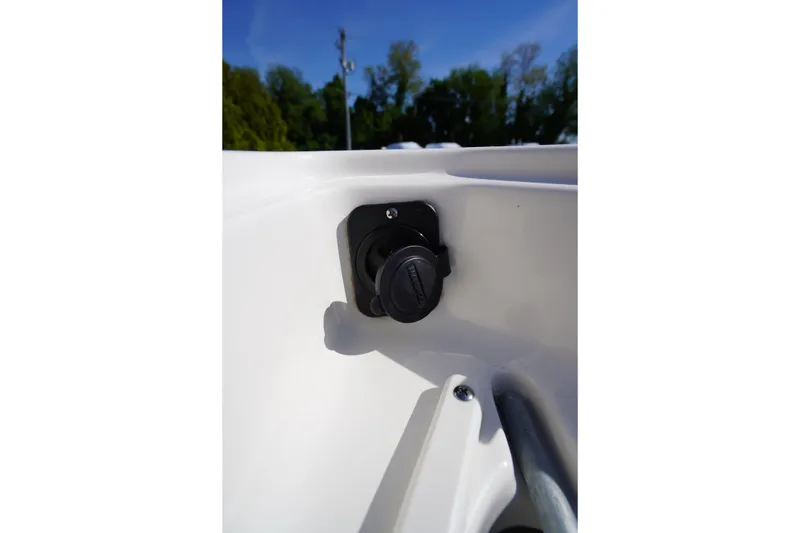 Slide: The Image of 2025 Key West 203 FS boat detail, featuring a power outlet on the interior panel. - 37