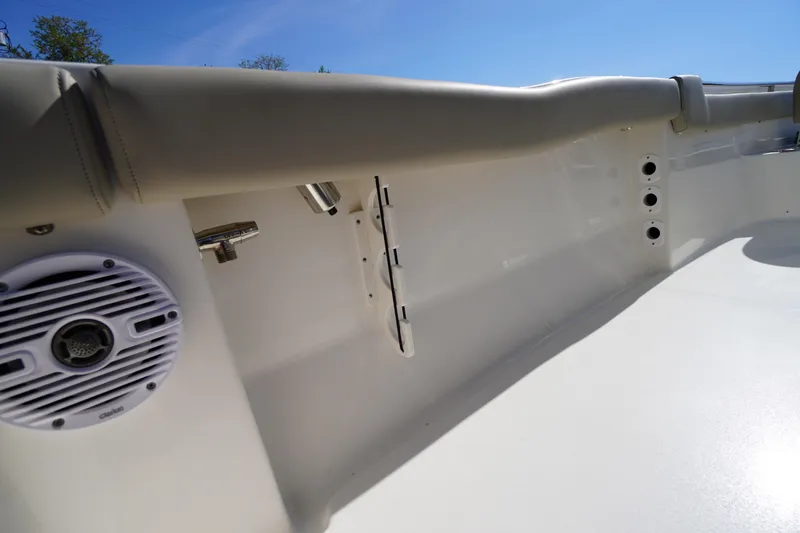 Slide: The Image of 2025 Key West 203 FS boat interior with speaker and rod holder. - 38