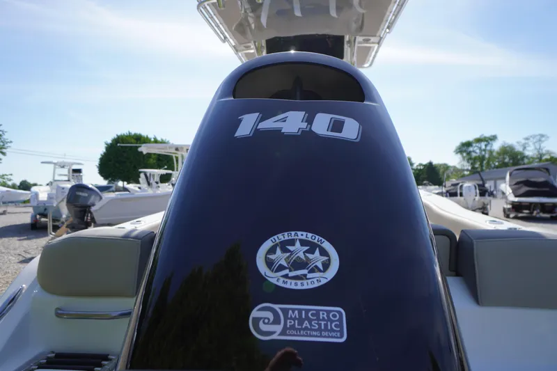 Slide: The Image of 2025 Key West 203 FS boat engine with "140" label and eco-friendly features. - 4