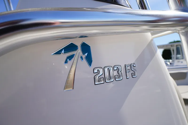Slide: The Image of 2025 Key West 203 FS boat emblem with sleek design and metallic finish. - 42
