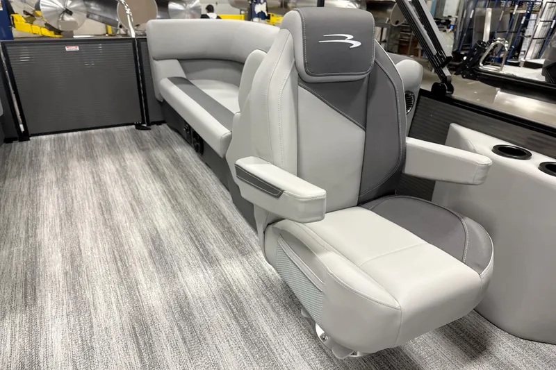 Slide: The Image of Luxurious seating in the 2026 Bennington 22 S Quad Bench pontoon boat interior. - 13