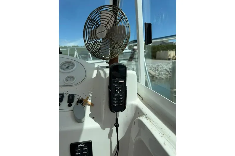 Slide: The Image of 2006 Baha Cruisers 300 GLE boat dashboard with fan and control panel. - 11