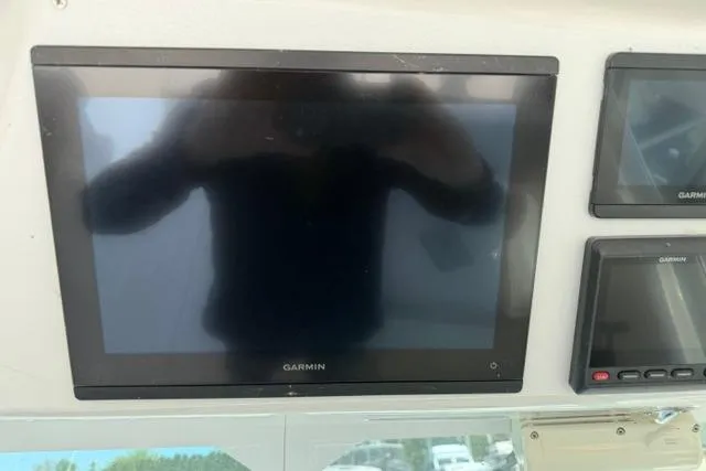 Slide: The Image of Garmin navigation screens on a 2006 Baha Cruisers 300 GLE boat dashboard. - 7
