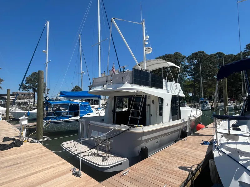 Slide: The Image of 2015 Beneteau Swift Trawler 34 Fly docked on a sunny day. - 1