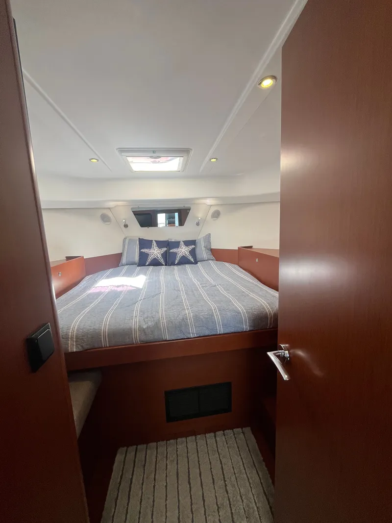Slide: The Image of Interior of 2015 Beneteau Swift Trawler 34 Fly, cozy bedroom. - 17