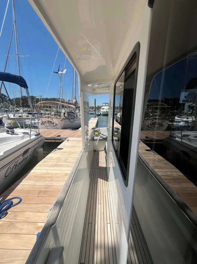 Slide: The Image of Beneteau Swift Trawler 34 Fly, 2015, docked at marina. - 34