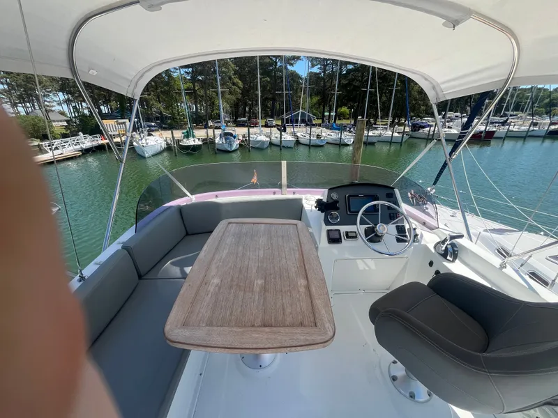 Slide: The Image of Beneteau Swift Trawler 34 Fly 2015, flybridge with table and helm. - 42