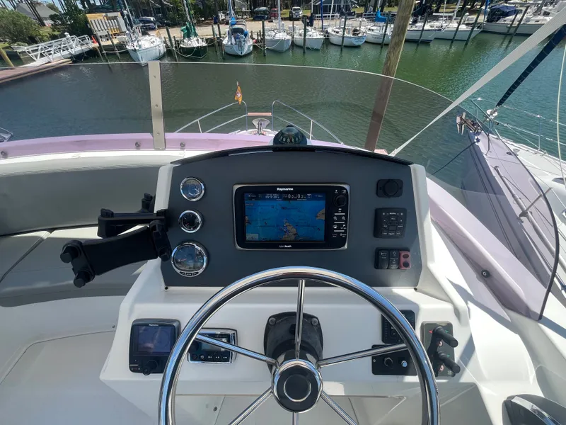 Slide: The Image of Helm of 2015 Beneteau Swift Trawler 34 Fly with navigation system. - 43