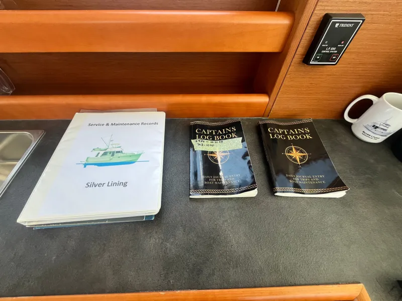 Slide: The Image of Service and log books on Beneteau Swift Trawler 34 Fly, year 2015. - 48
