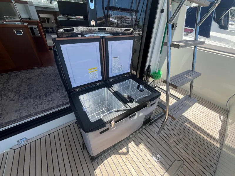 Slide: The Image of Beneteau Swift Trawler 34 Fly 2015 with open fridge on deck. - 5